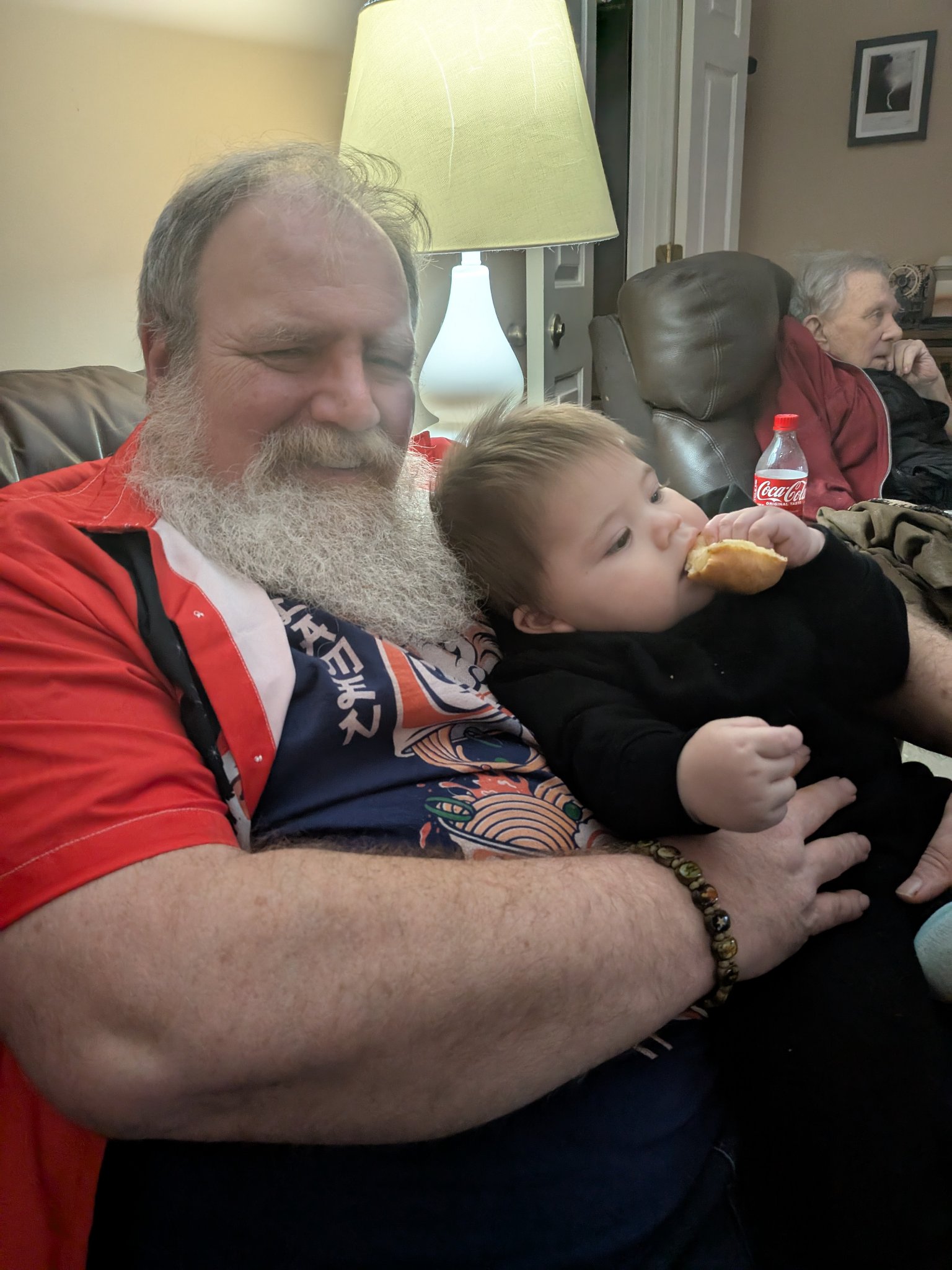 A visit with the grandkids — the wider frame of the same moment, Bob in the background, Sat · Dec 21, 2024