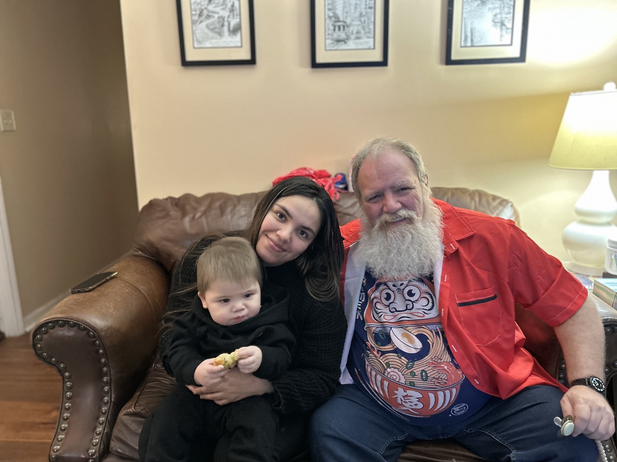 A visit with the grandkids — Jennifer and the toddler on the couch with Jeffry, Sat · Dec 21, 2024