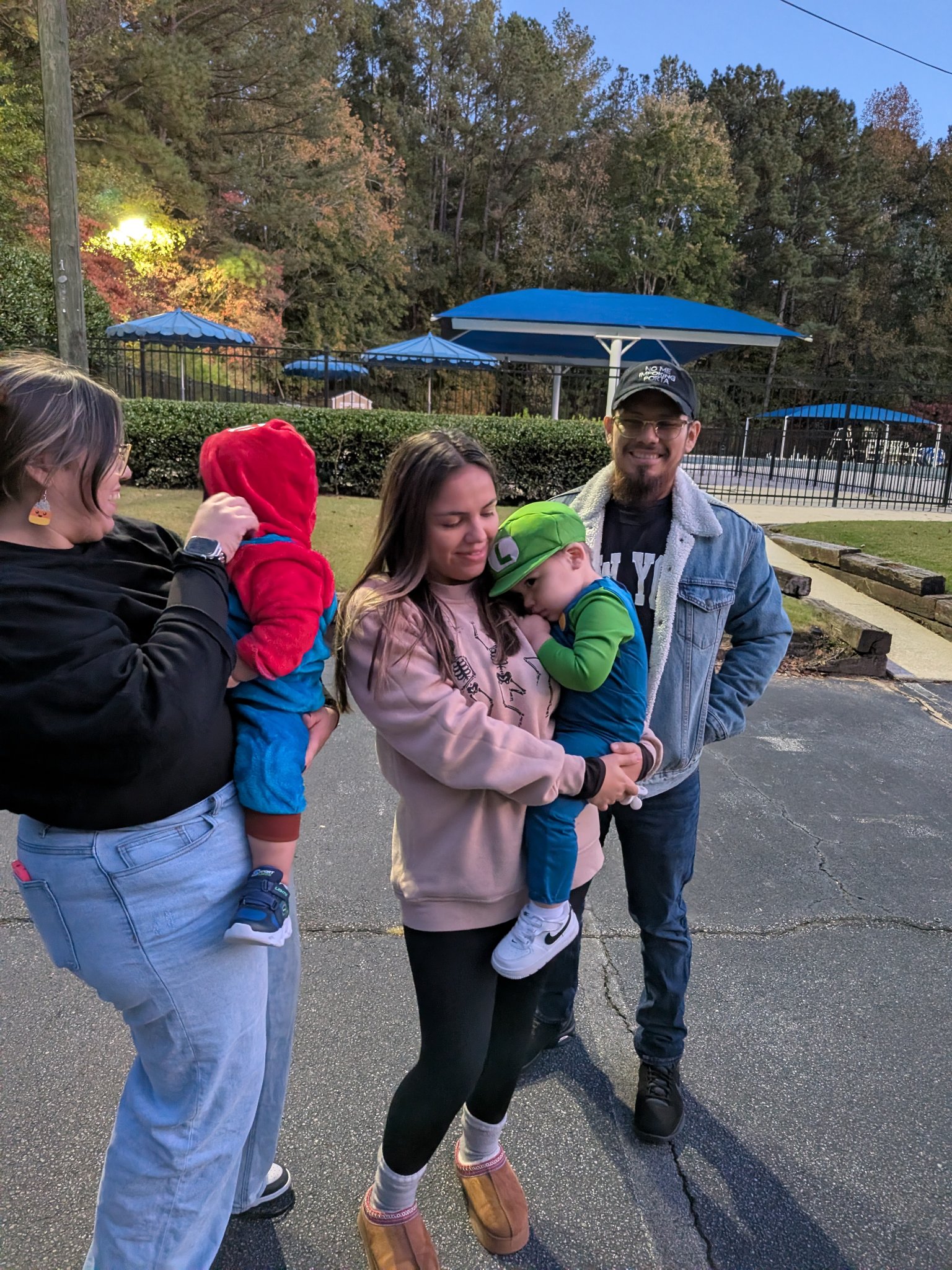 First Halloween trick-or-treating with my grandchildren — the group walking, candid, Fri · Oct 31, 2025